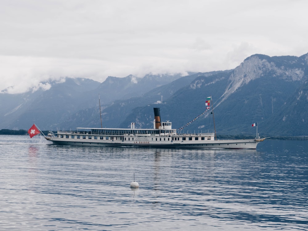 white and black cruise ship on blue sea during daytime