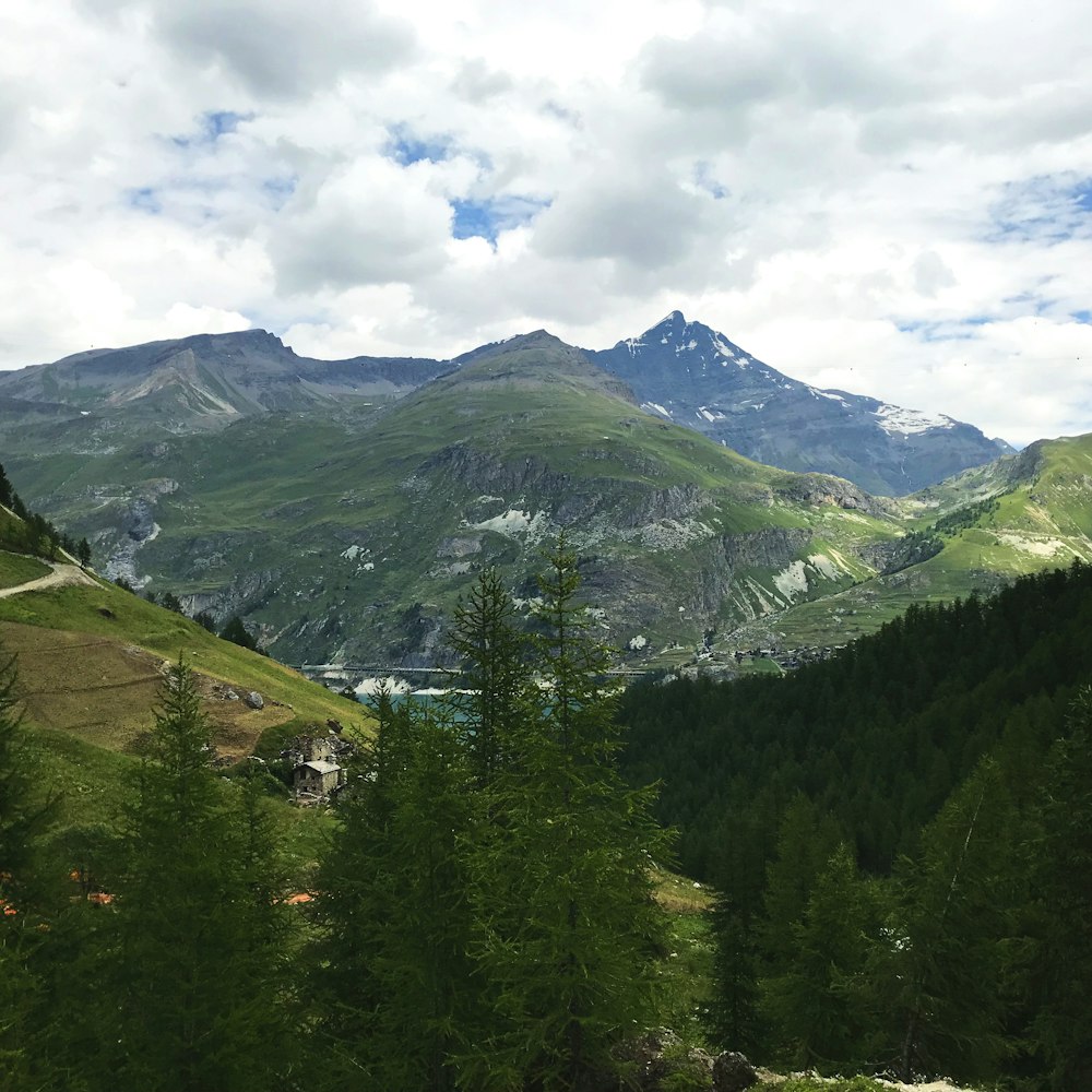 aerial photography of mountain under blue and white skies during daytime