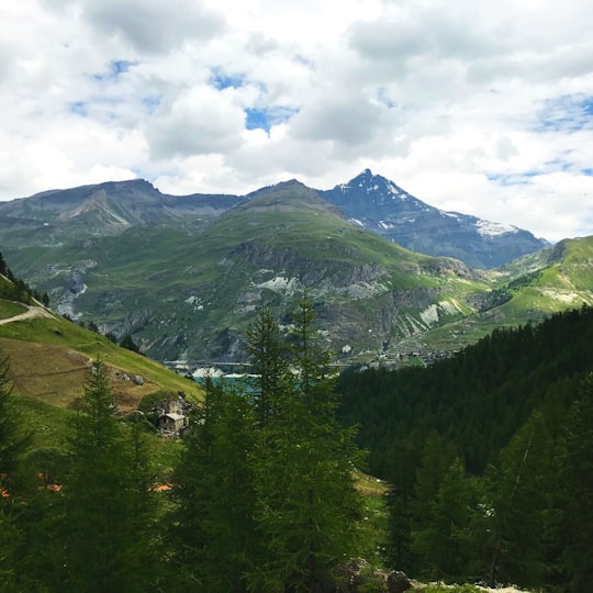 aerial photography of mountain under blue and white skies during daytime in Tignes France