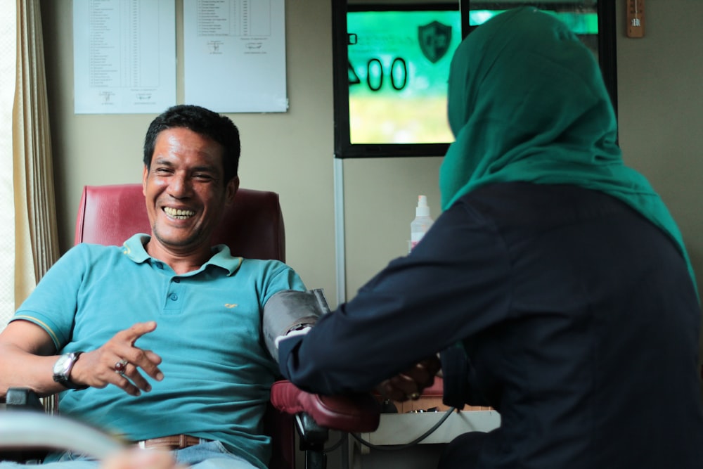 man sitting on dental chair