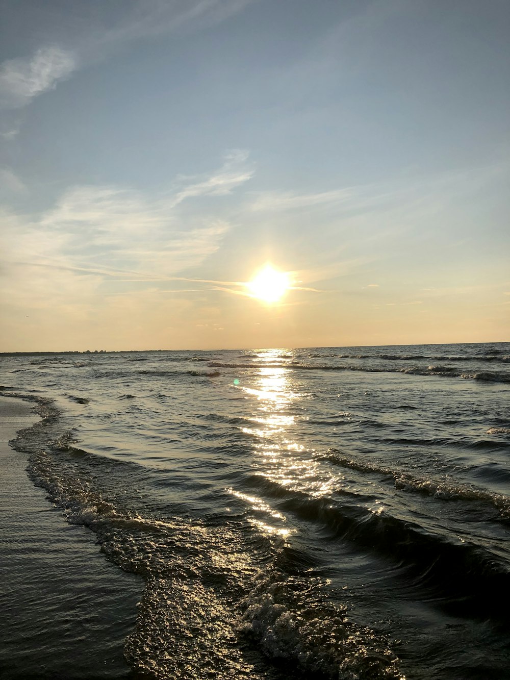 bubbles forming on water during sunrise