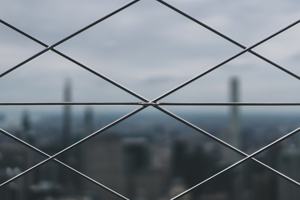 closeup photo of gray metal mesh-link fence