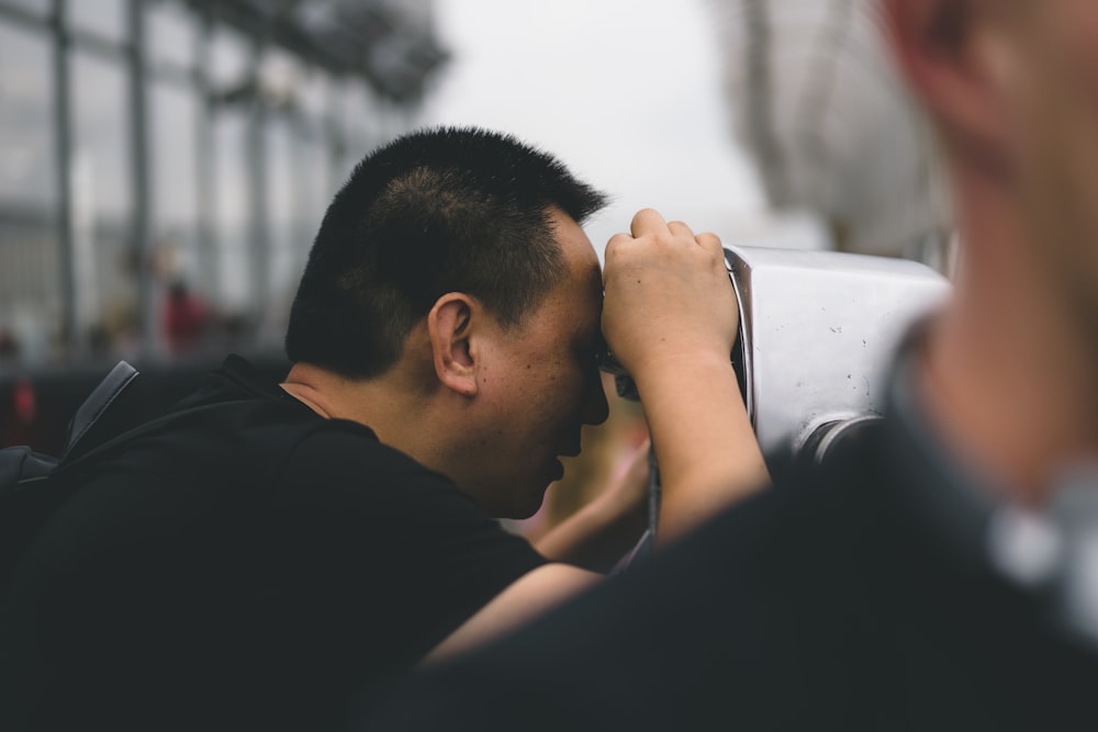 a man holding his head in his hands