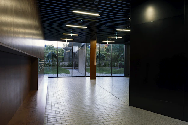 Interior of a smart home with automated lighting and eco-friendly materials.