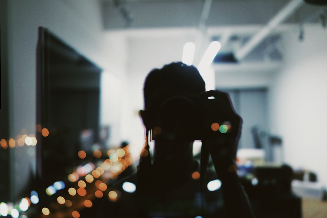 silhouette of person talking photo in front of mirror