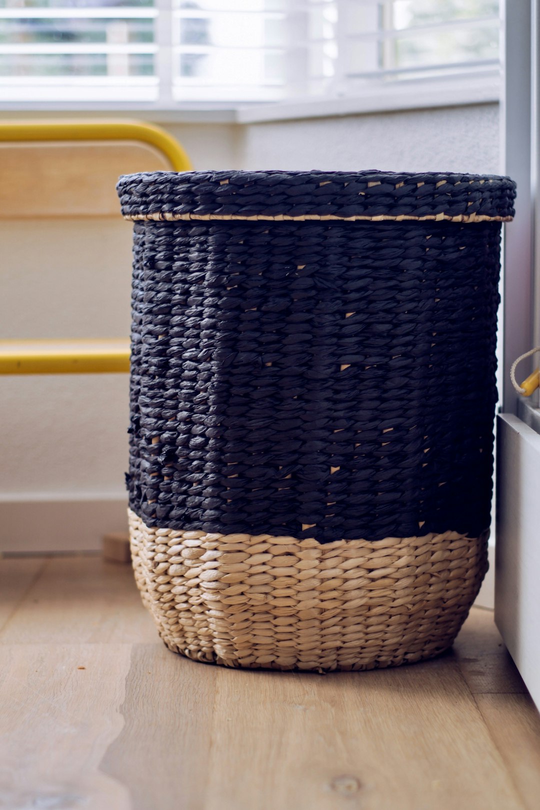 blue and beige container near window