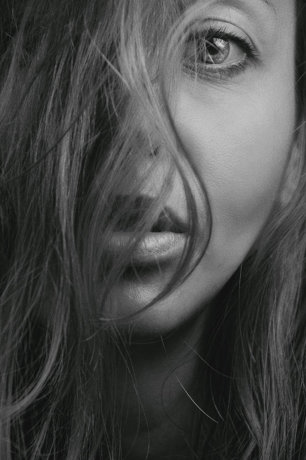 a black and white photo of a woman's face