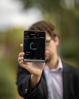 person holding Android tablet computer