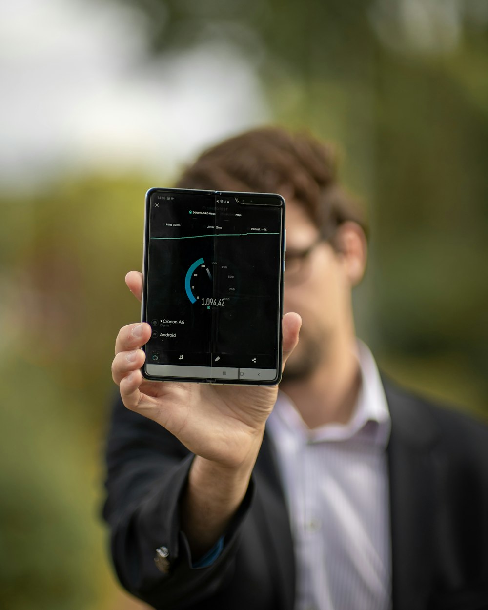 person holding Android tablet computer