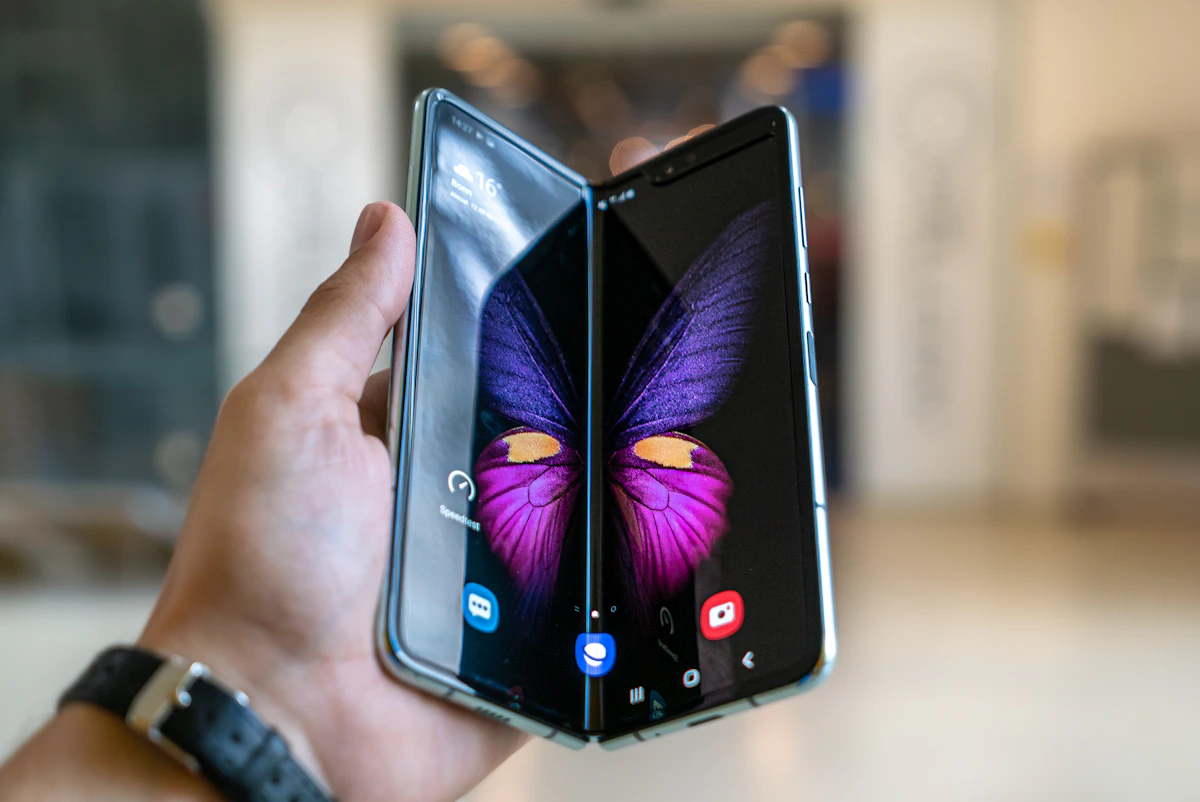 Person holding a foldable smartphone