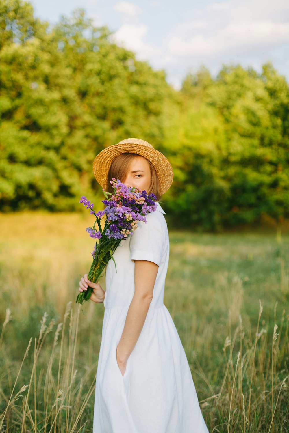 woman holding flowers