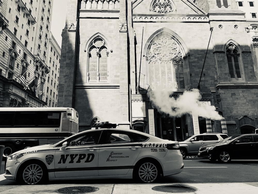 silhouette of NYPD sedan parked on roadside