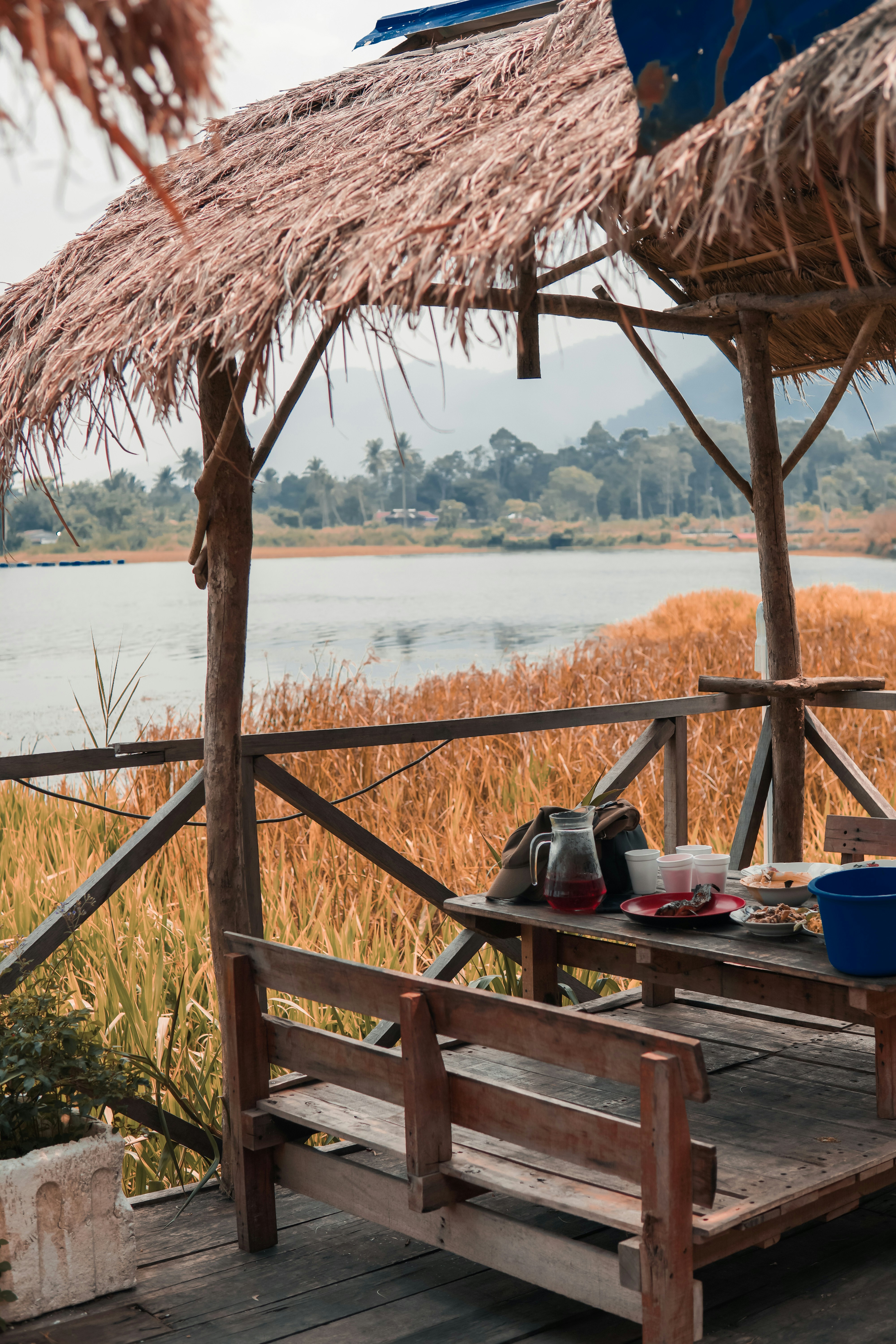 Brown nipa hut beside sea photo Free Wood Image on Unsplash