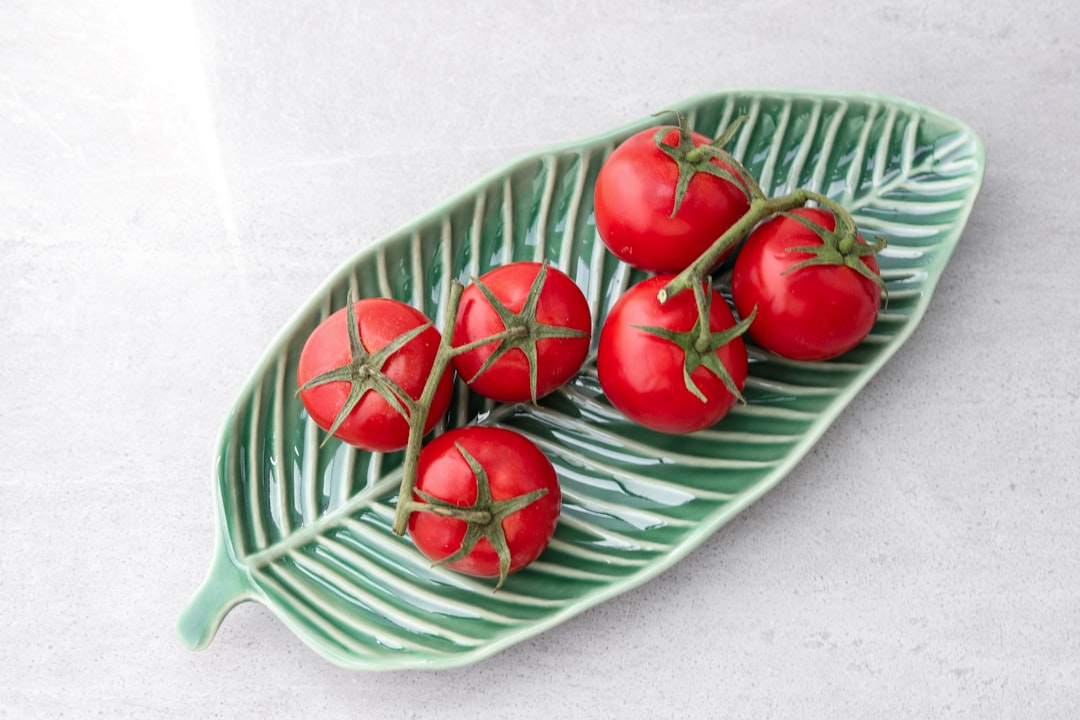 tomatoes on green leaf plate