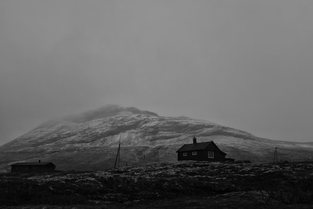 a black and white photo of a snow covered mountain