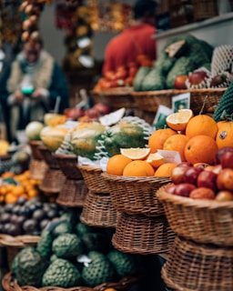 selective focus photography of displayed basket of fruits