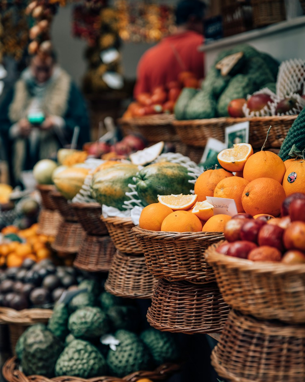 selective focus photography of displayed basket of fruits