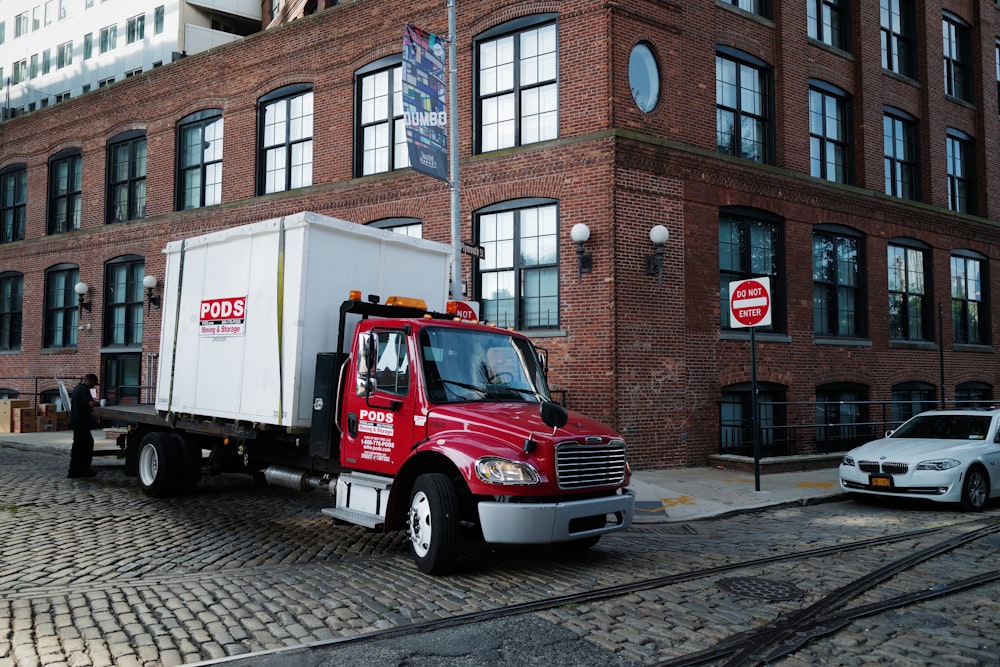 red cargo truck on road during daytime