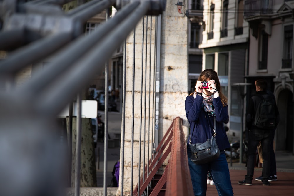 shallow focus photo of person in blue jacket