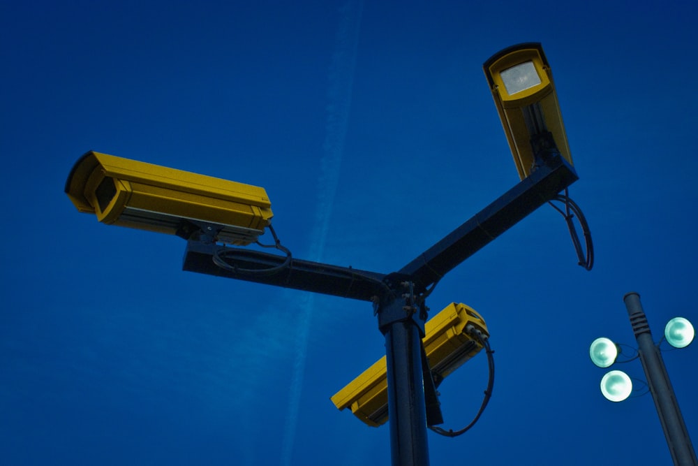 yellow surveillance camera