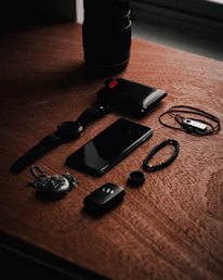Close-up of sleek sports accessories arranged on a wooden table with natural light.