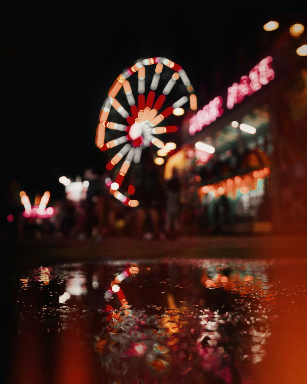 a ferris wheel in a carnival at night