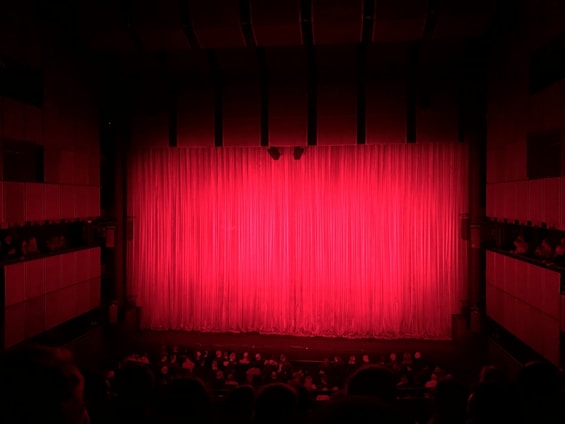people sitting on theater seat