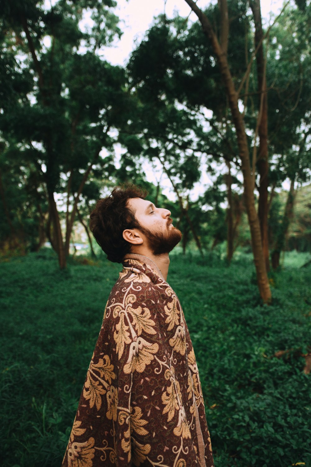 man standing near tree