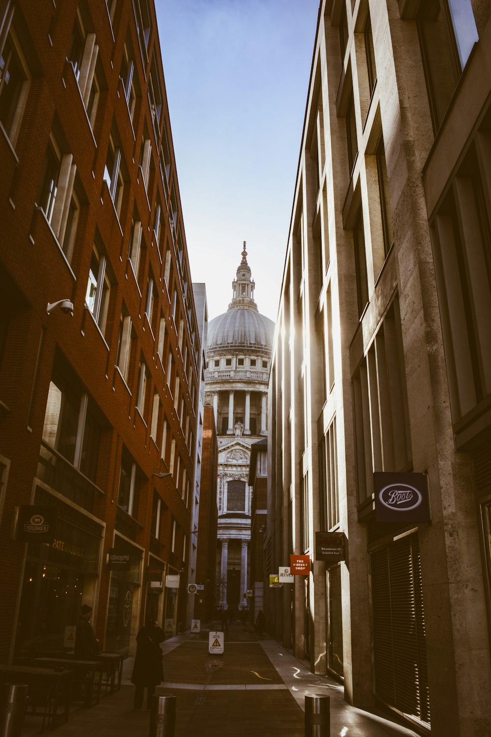 woman walking beside building