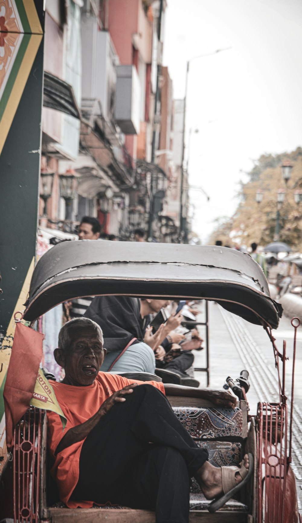 man sitting in vehicle