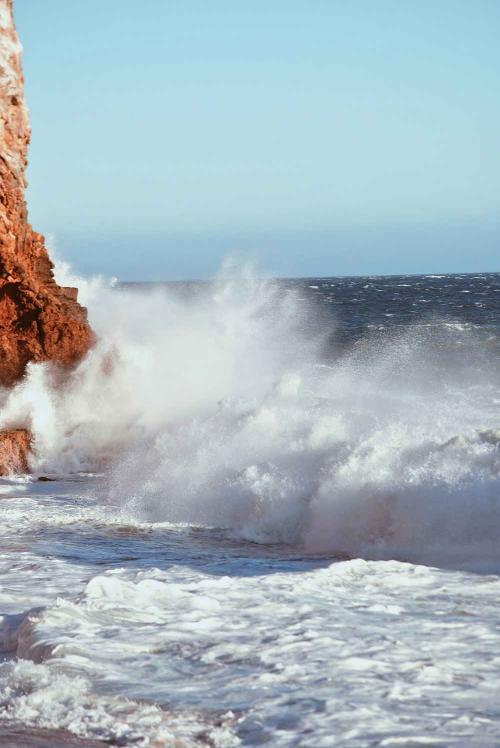 time-lapse photography of splashing sea waves