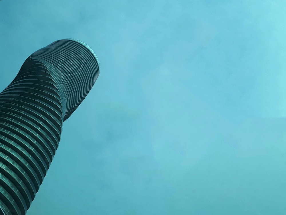 a very tall building with a sky background