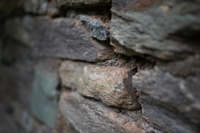 A weathered stone wall detail with natural patina.