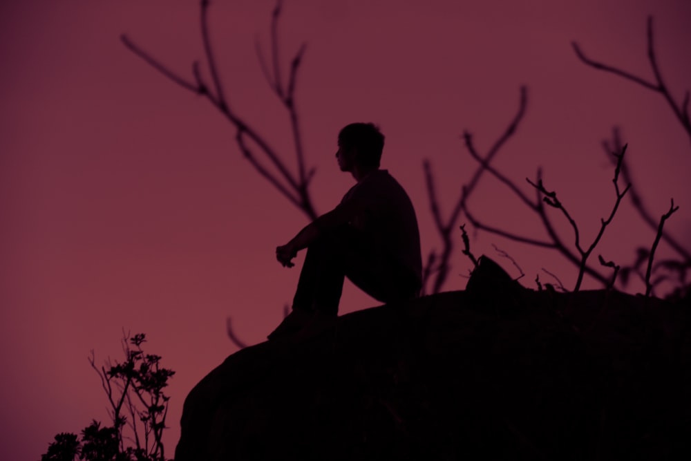 silhouette photography of person sitting