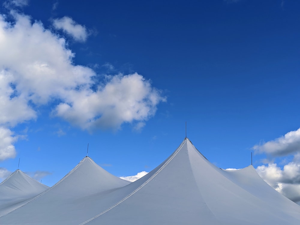 white canopy tents under blue sky during daytime