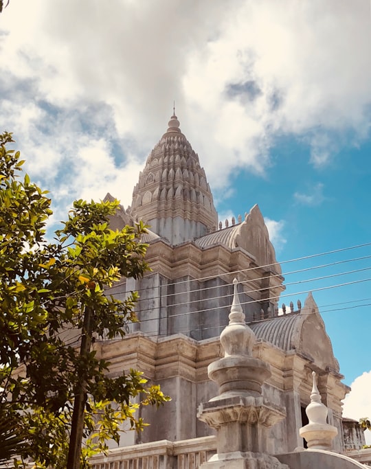 white temple under cloudy sky in Phuket Thailand