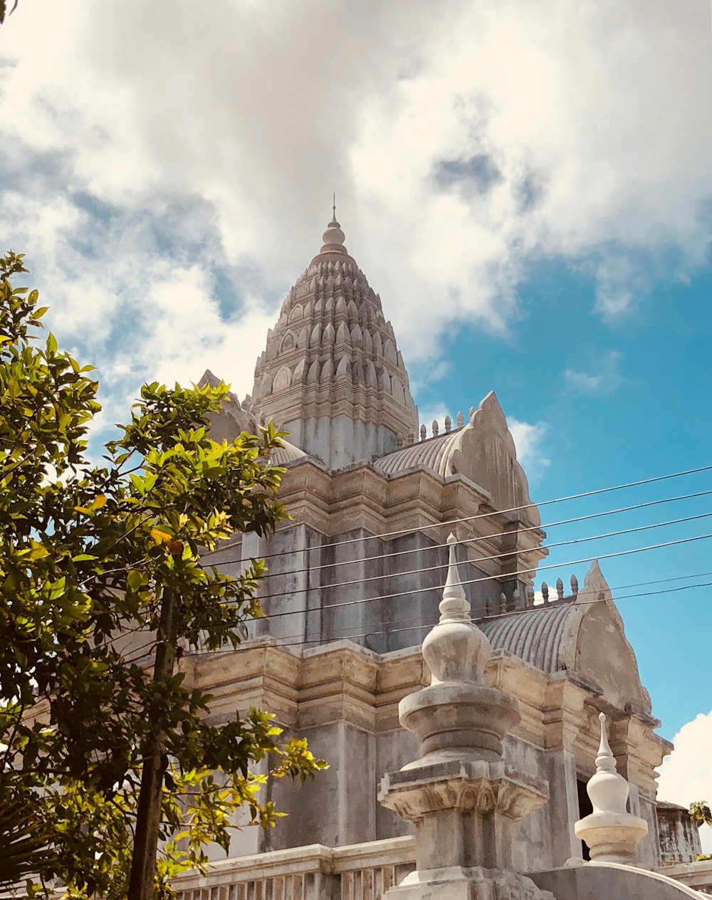 white temple under cloudy sky