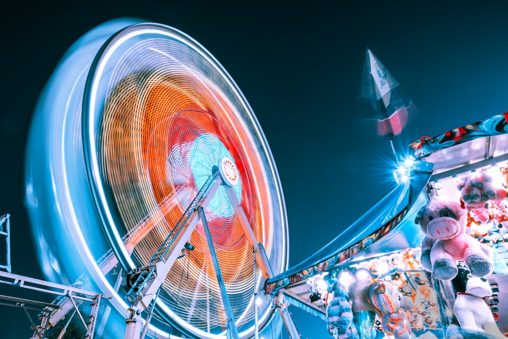 time-lapse photography of Ferris wheel at night