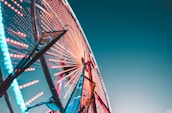 worm's eye view of a lit Ferris Wheel