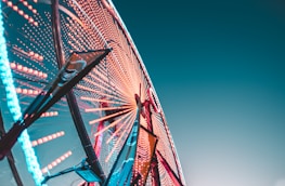 worm's eye view of a lit Ferris Wheel