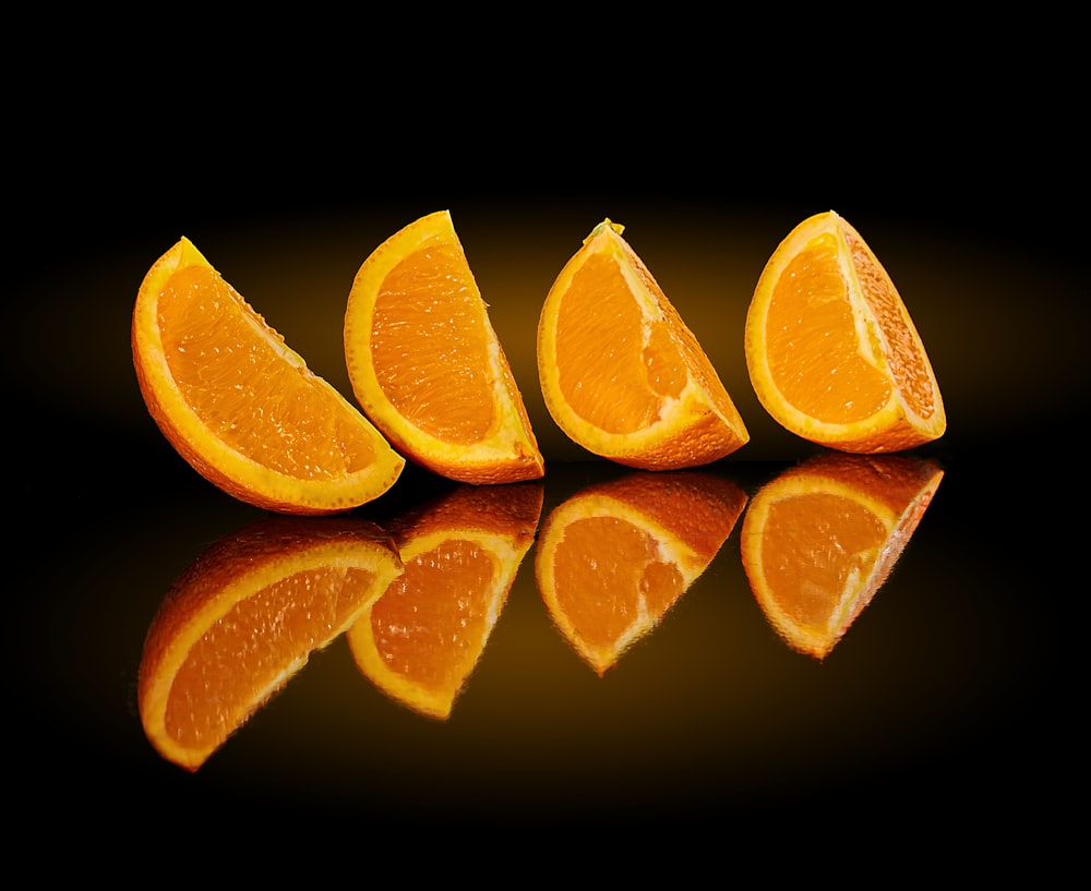 4 sliced orange fruits
