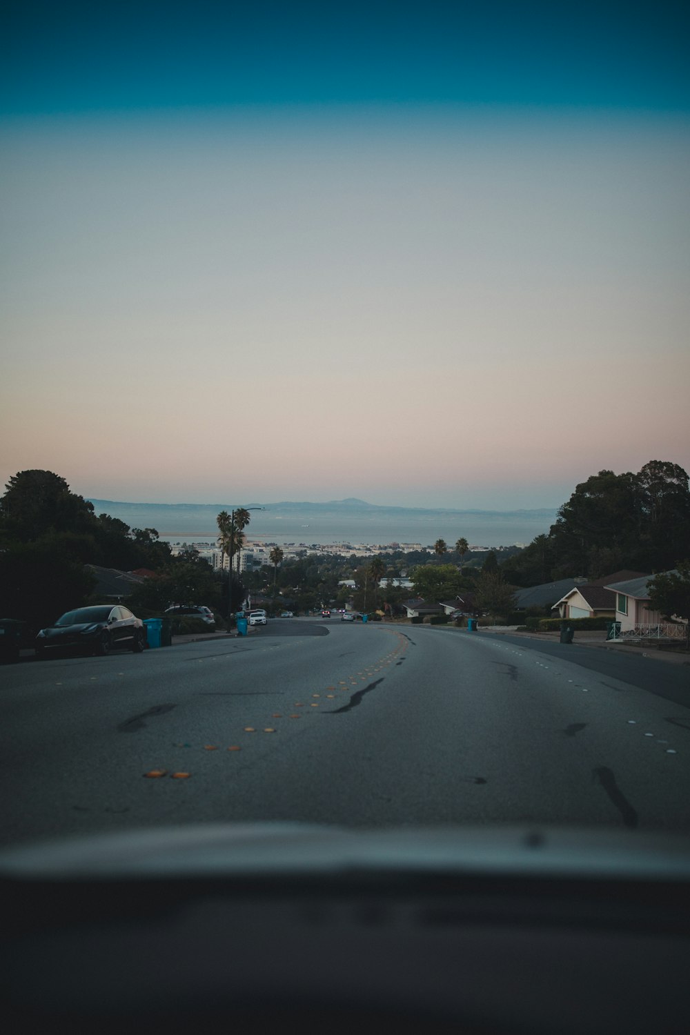 gray concrete road photo during dusk