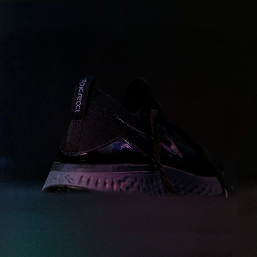 photo of unpaired black Nike sneaker
