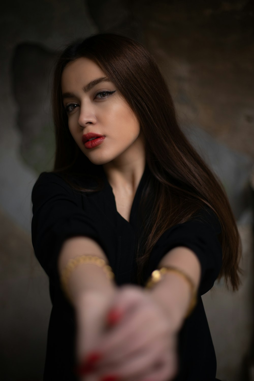 portrait of woman wearing black dress shirt looking at side