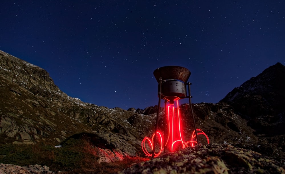 lighted rocketship at nighttime