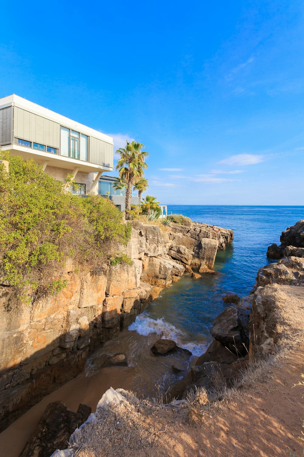 building near rock cliff