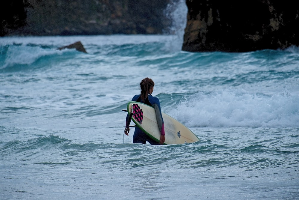 woman holding surfboard