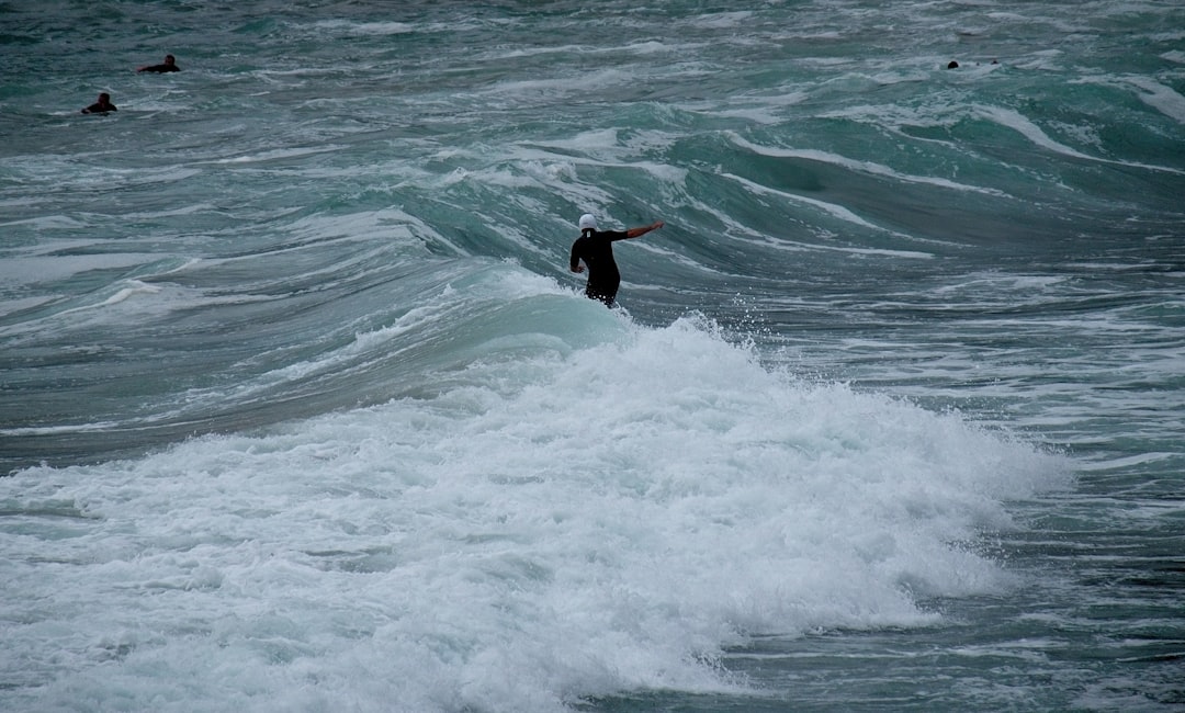 men surfing