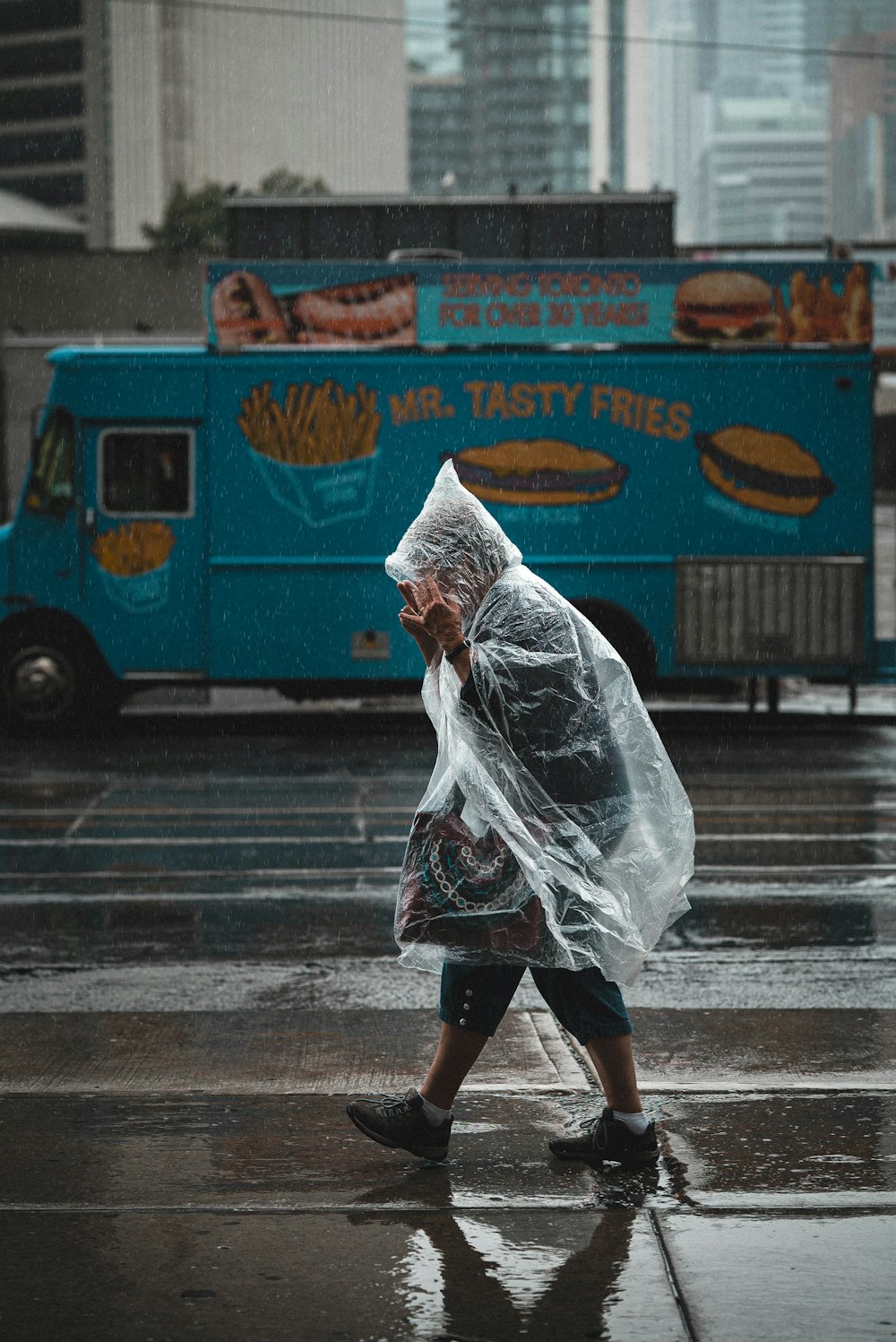 man walking wearing raincoat