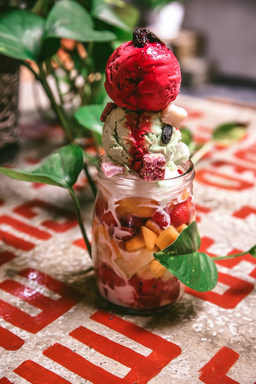 ice cream with sliced fruits in jar